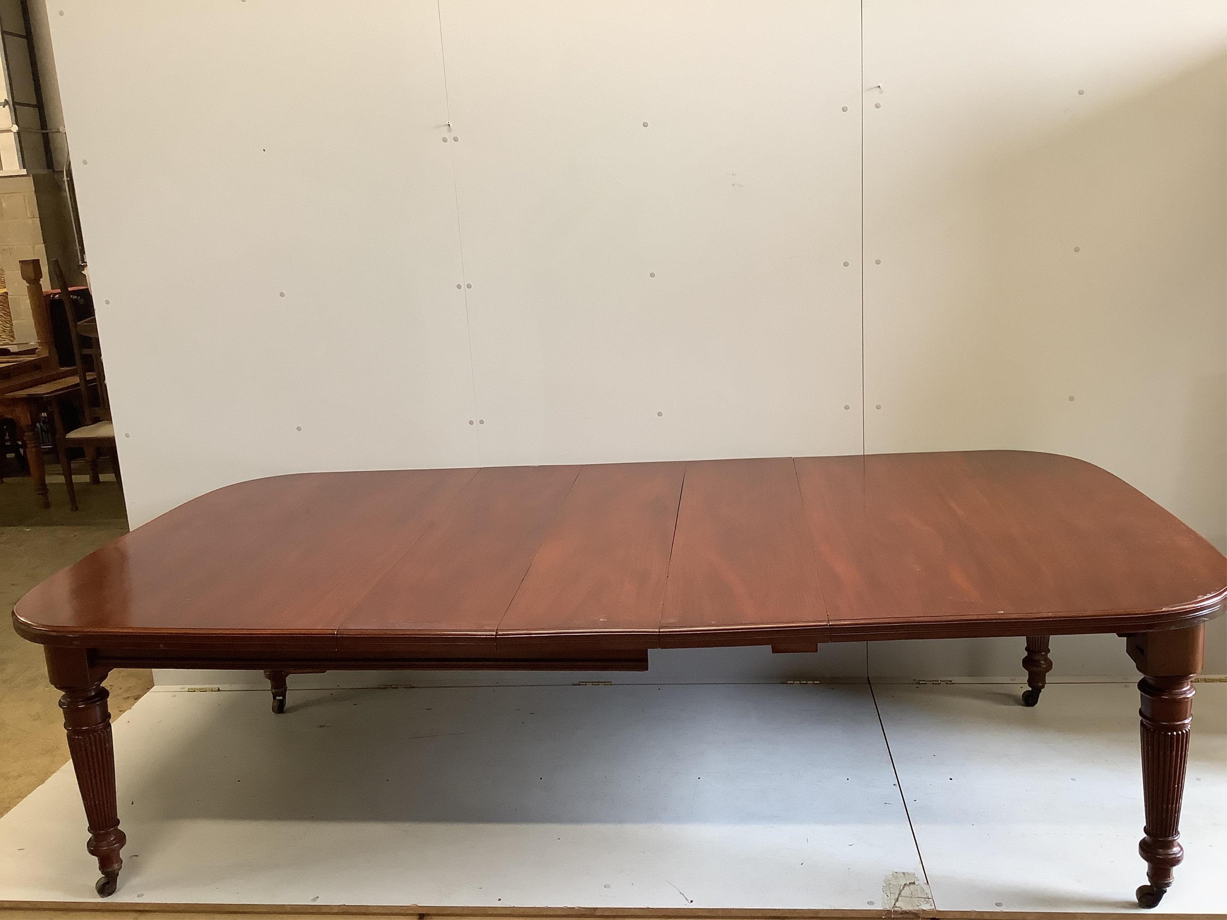 A late Victorian mahogany extending dining table, width 270cm extended, three spare leaves, depth 136cm, height 74cm. Condition - fair